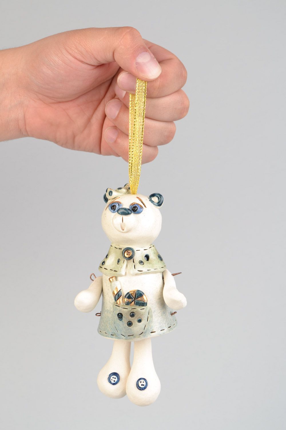 Handmade decorative ceramic wall hanging bell in the shape of bear with candies photo 1