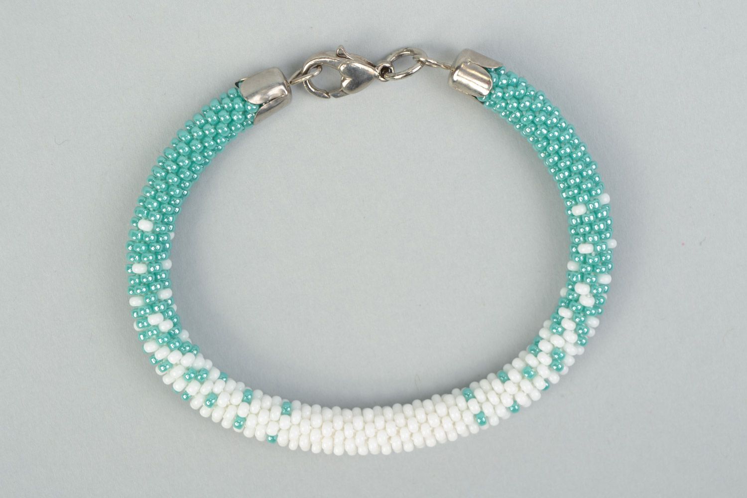 Tender handmade beaded cord wrist bracelet in white and turquoise color  photo 2