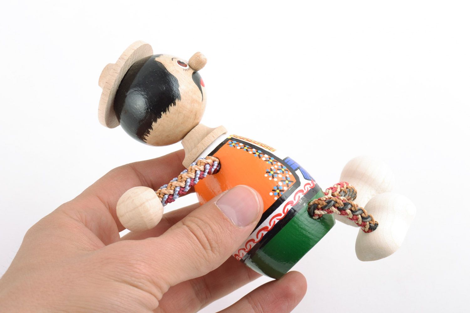 Homemade painted wooden eco toy in the shape of man in Ukrainian costume photo 2