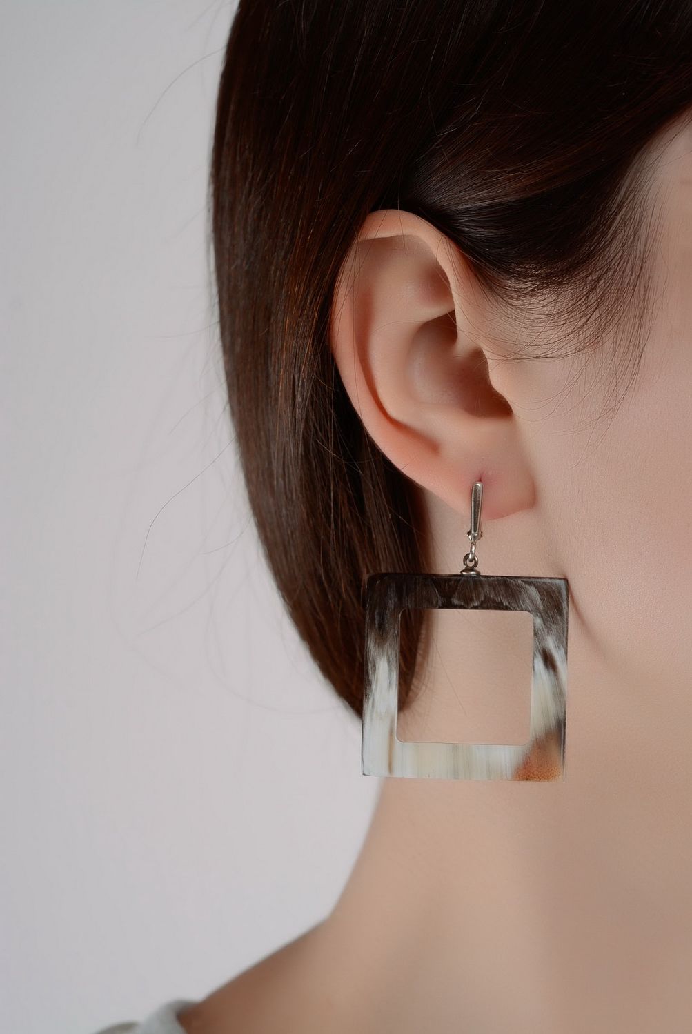 Silver earrings with horn photo 2