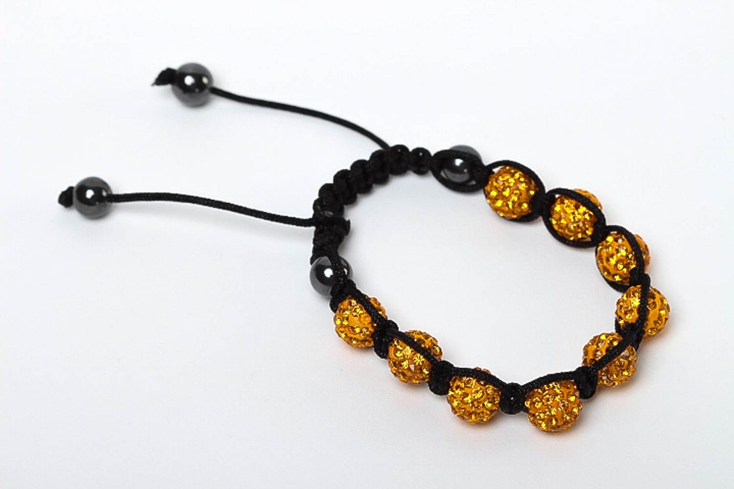 Gold color beads bracelet on the black rope for women photo 2