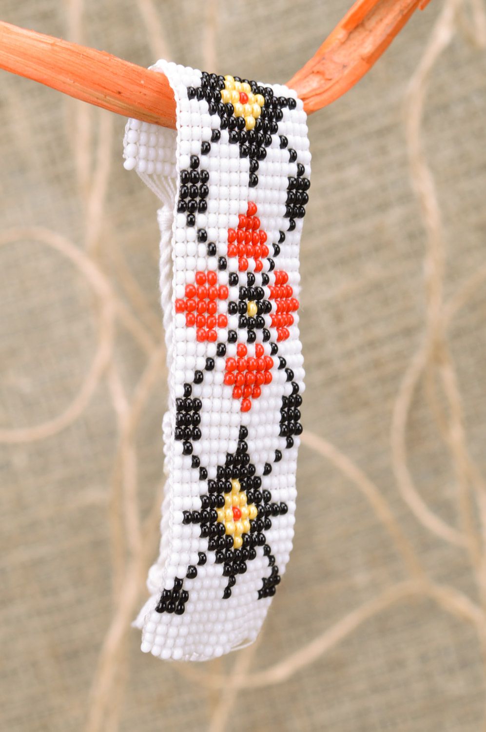 Handmade wide women's woven bead bracelet of white color with ornament photo 1