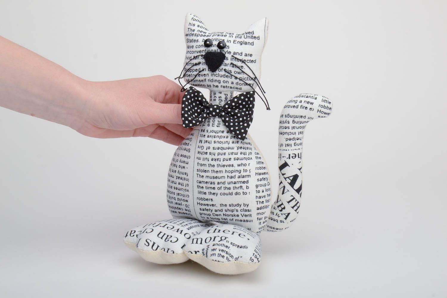 Handmade soft toy sewn of cotton with newspaper pattern Cat with black bow tie photo 5