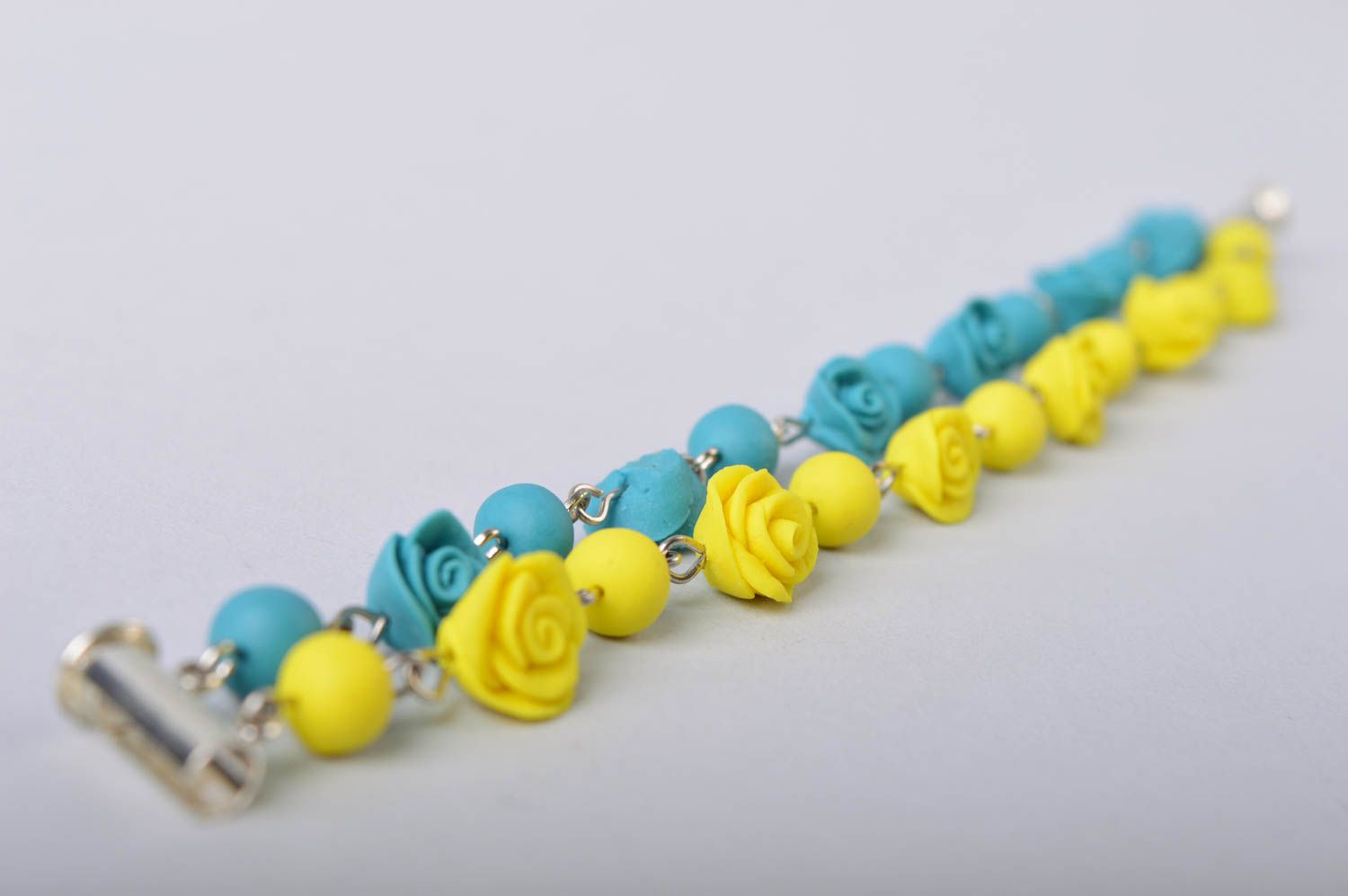 Handmade bright wrist bracelet with blue and yellow cold porcelain rose flowers photo 4