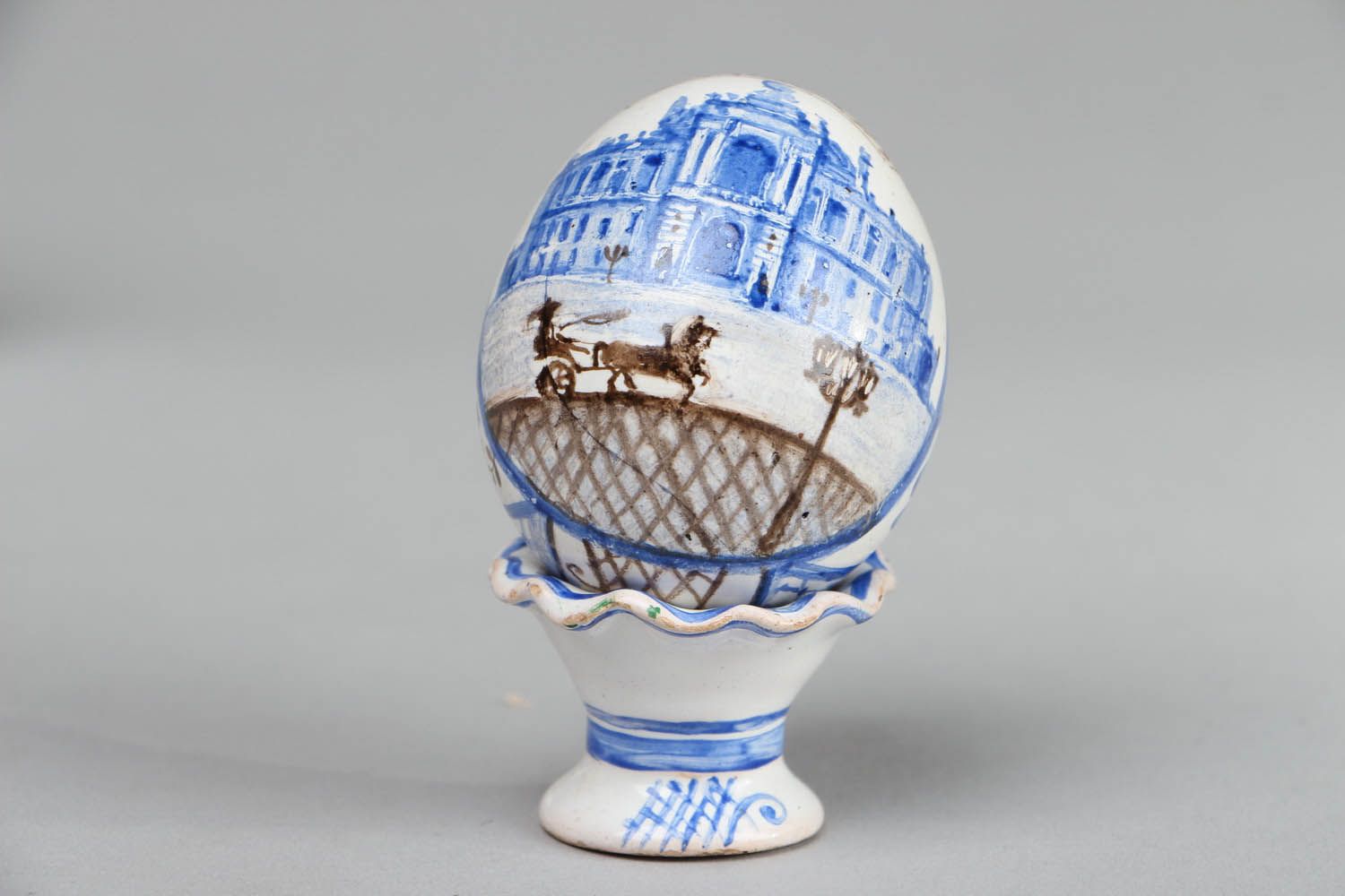 Ceramic egg on pedestal photo 2
