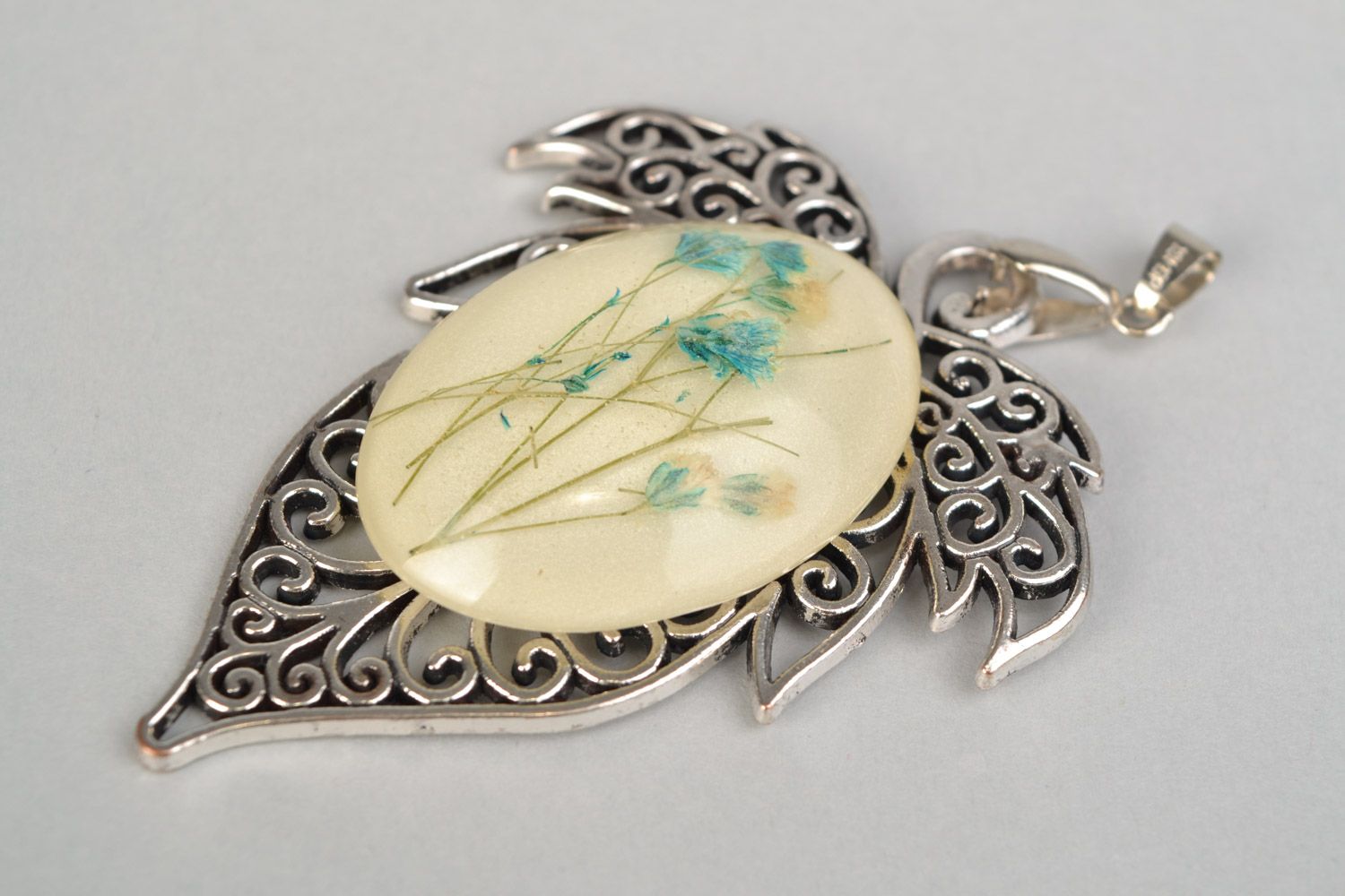 Handmade lacy leaf-shaped pendant with natural flowers in epoxy resin on chain photo 5