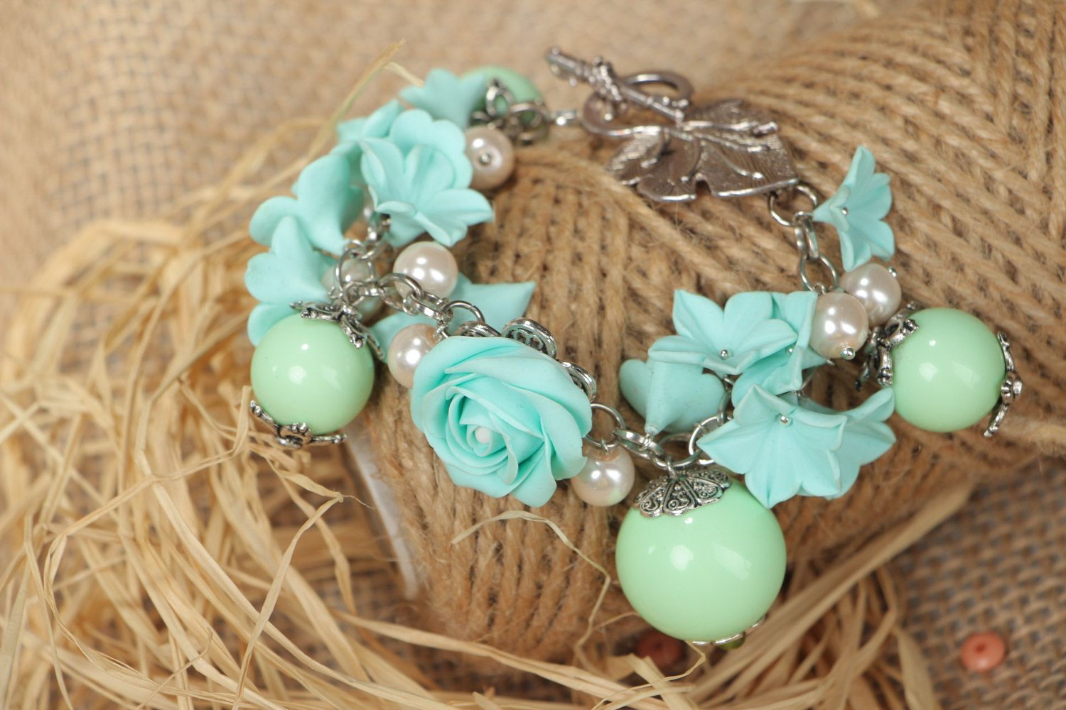 Handmade beautiful designer flower bracelet with charms made of polymer clay in mint color photo 2