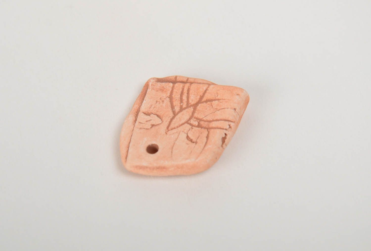Small flat craft blank hand made of pottery clay for pendant necklace creation photo 3