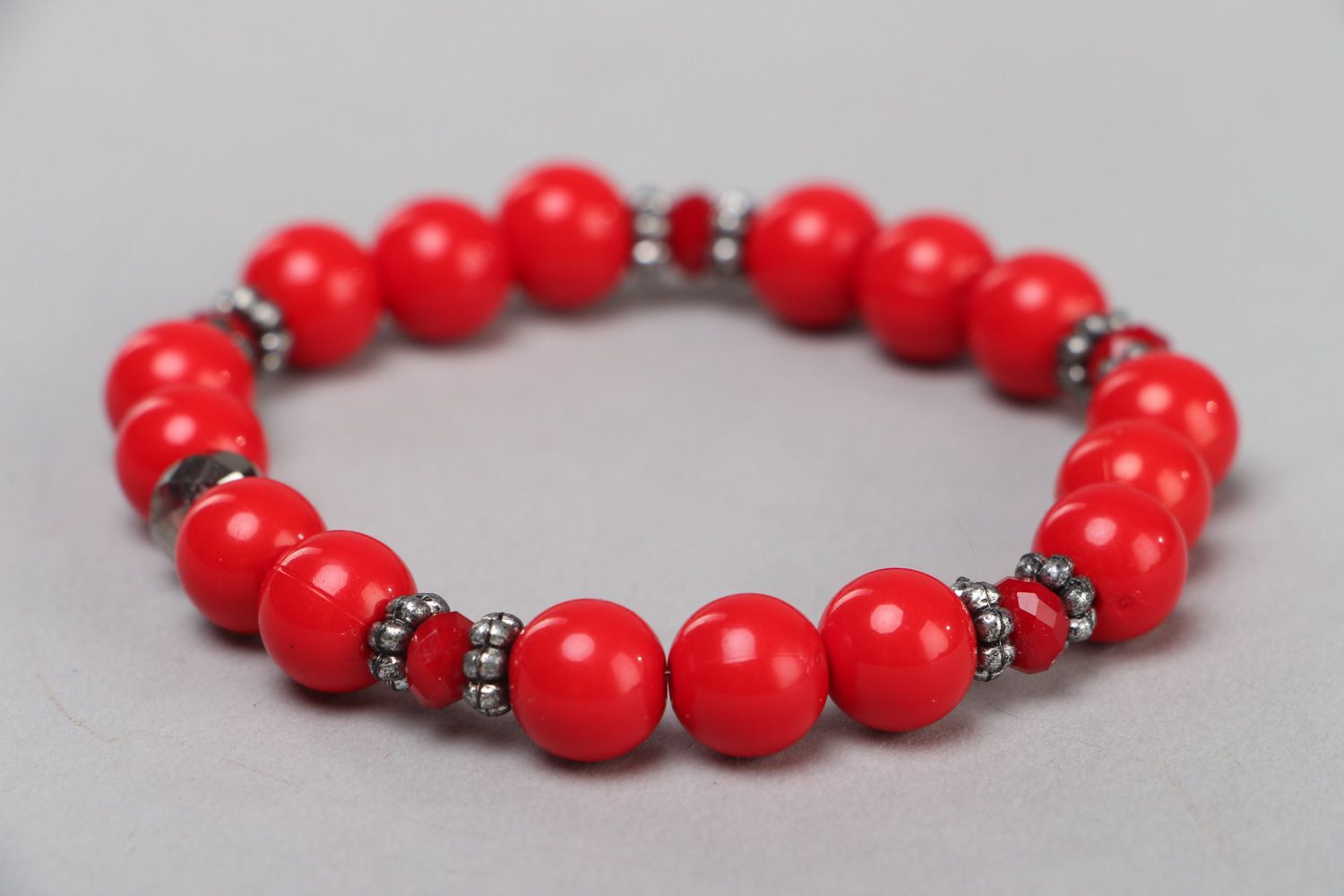 Women's red bracelet hand made of plastic and glass beads in 1 turn photo 1