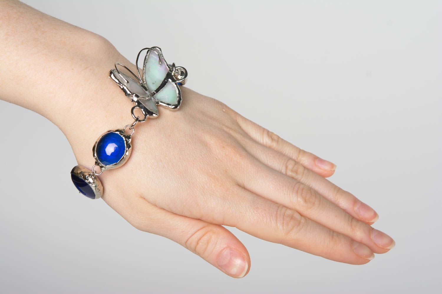 Handmade designer metal wrist bracelet with blue glass and butterfly photo 4