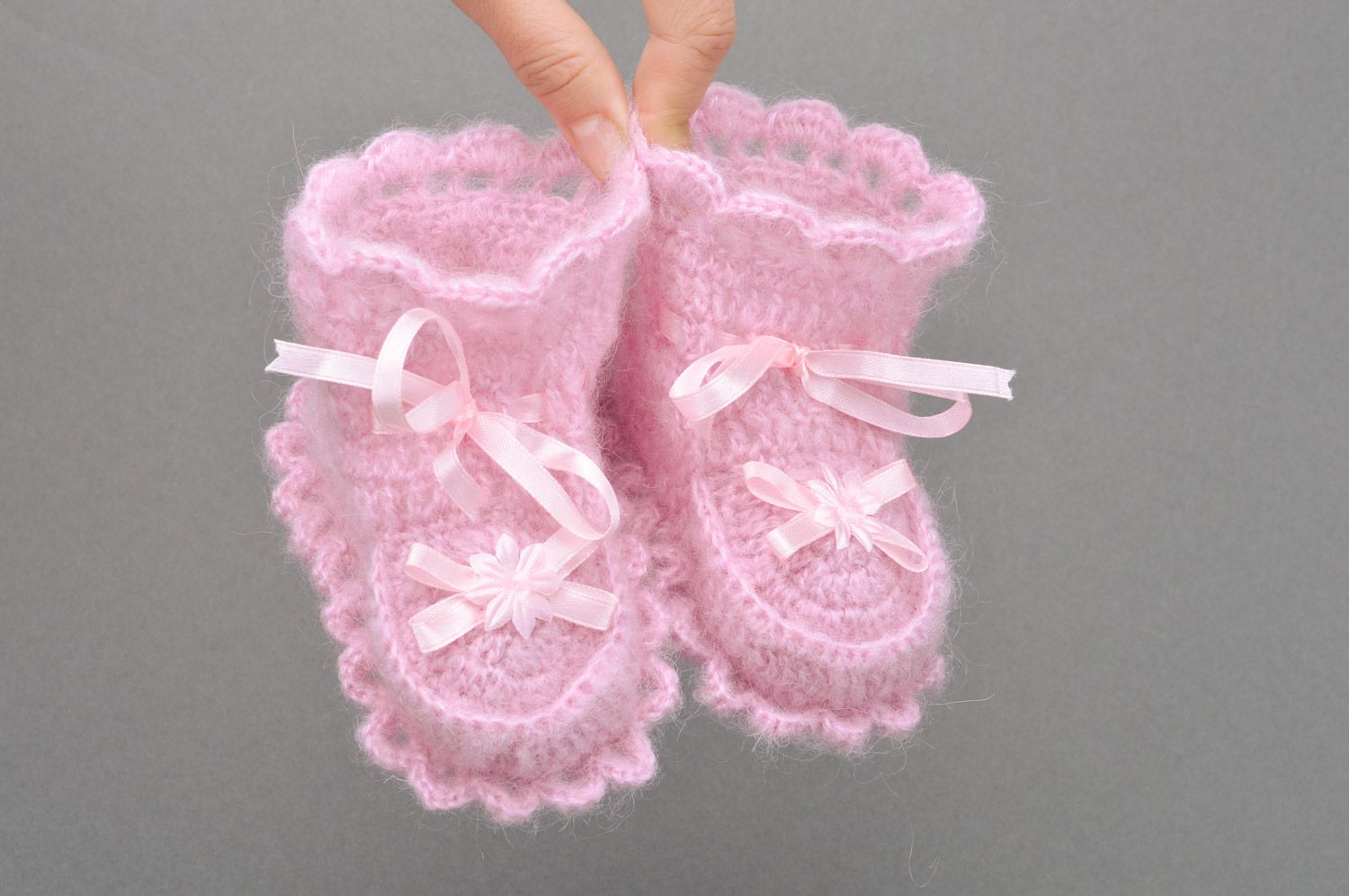 Handmade crocheted baby booties for girls made of angora in pink color with bows photo 3