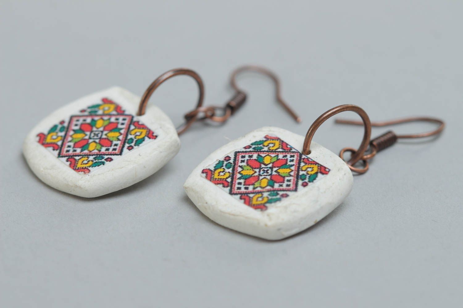 Handmade designer white earrings with Ukrainian symbolism made of polymer clay photo 3