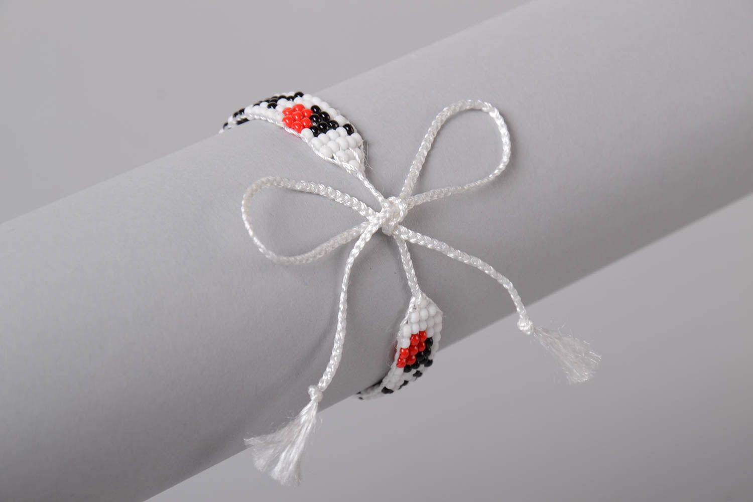 White, black, red, and green color beads strand bracelet on the white cord for teen girls photo 2