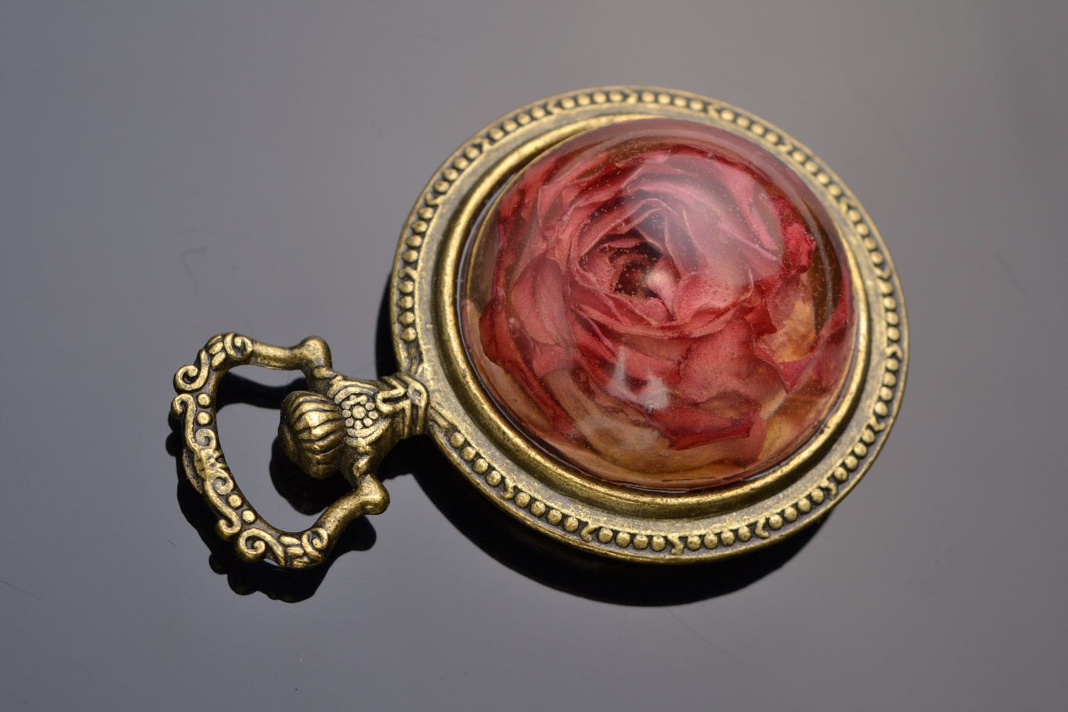 Beautiful women's handmade vintage pendant with real rose coated with epoxy photo 1
