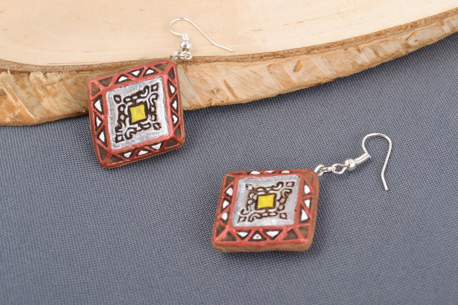 Handmade ceramic dangling earrings in the shape of rhombus with acrylic painting photo 1