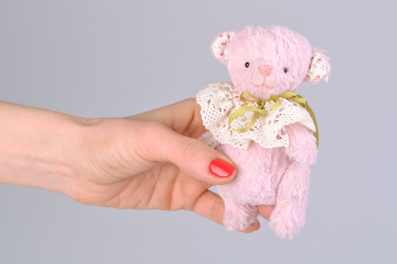 Handmade designer soft toy bear sewn of fabric of pink color with lacy collar  photo 2