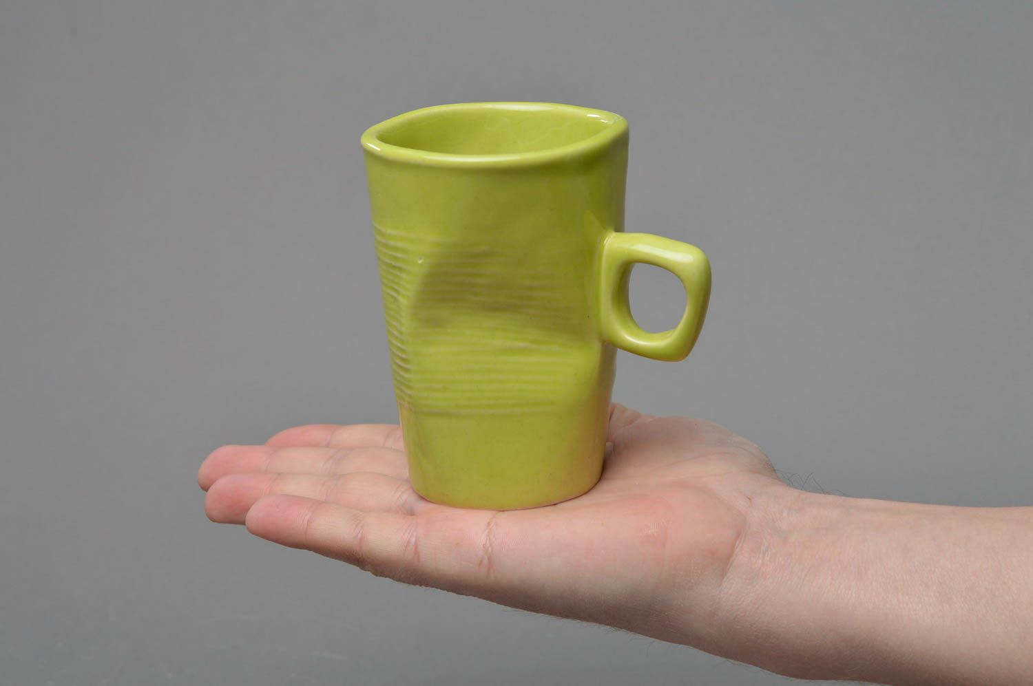 Fake plastic ceramic crinkled cup of yellow, green color with handle photo 4