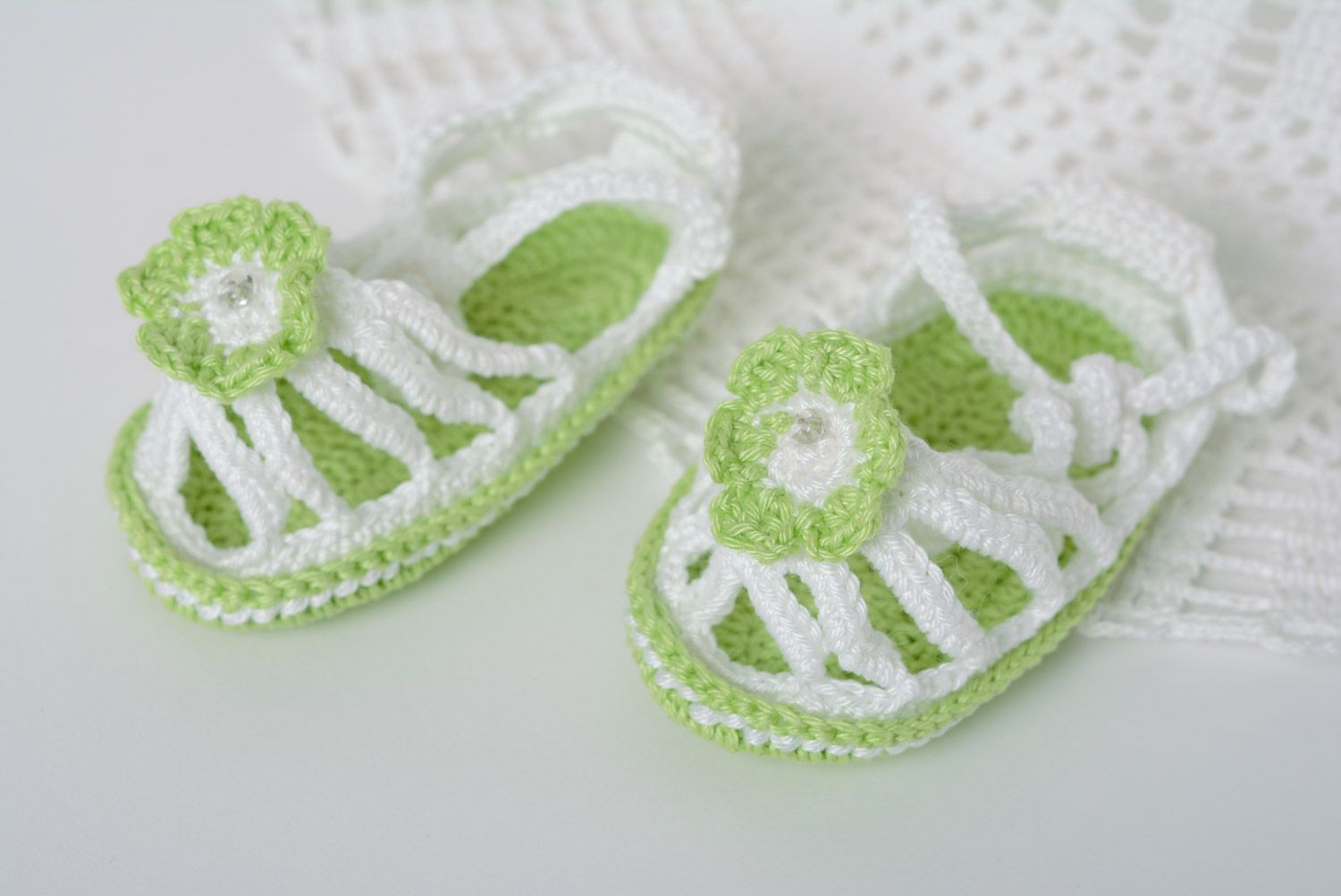 Handmade summer baby booties crocheted of white and green acrylic threads for girl photo 1