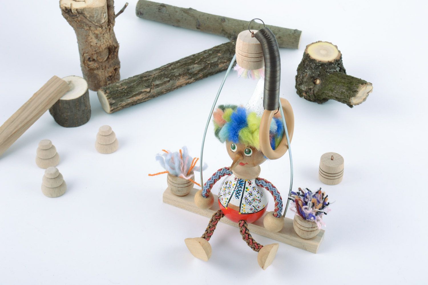 Деревянная игрушка мальчик на качелях с росписью ручной работы детская авторская фото 1