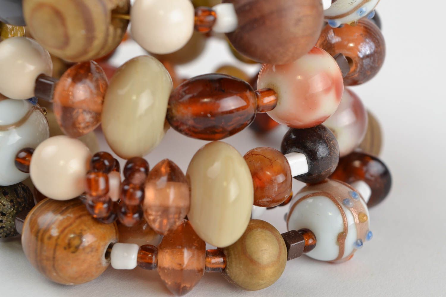 Handmade designer women's wrist bracelet with colorful wooden and glass beads photo 3