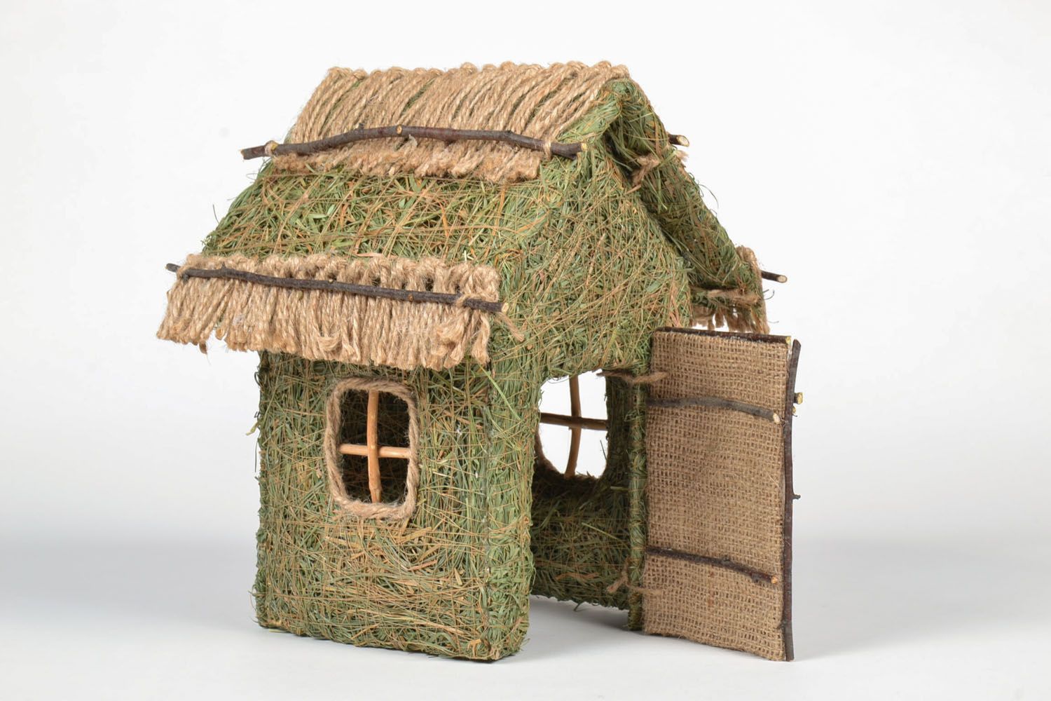 Decorative house made of forest grass photo 1