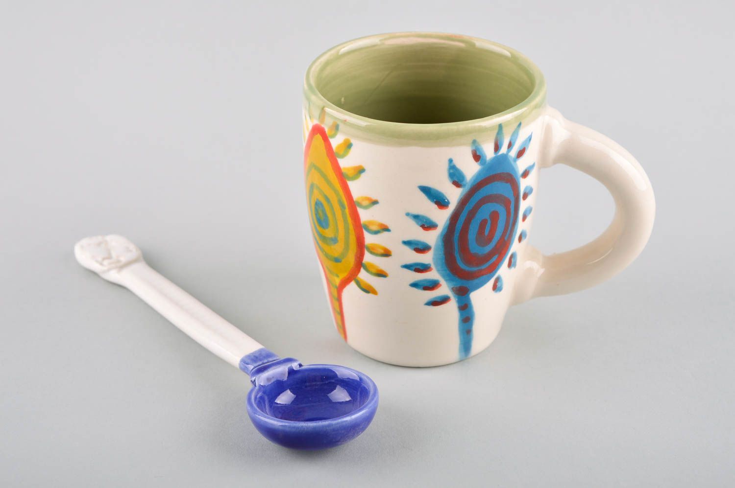 Ceramic glazed cup with ceramic spoon and sun cave pattern photo 5