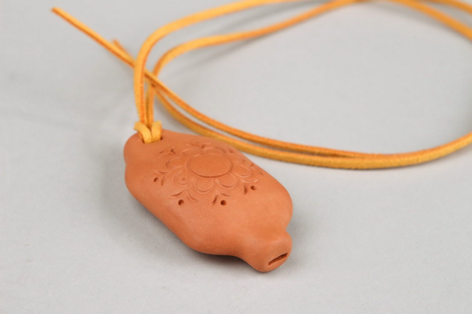 Tin whistle pendant made of clay with flower photo 2