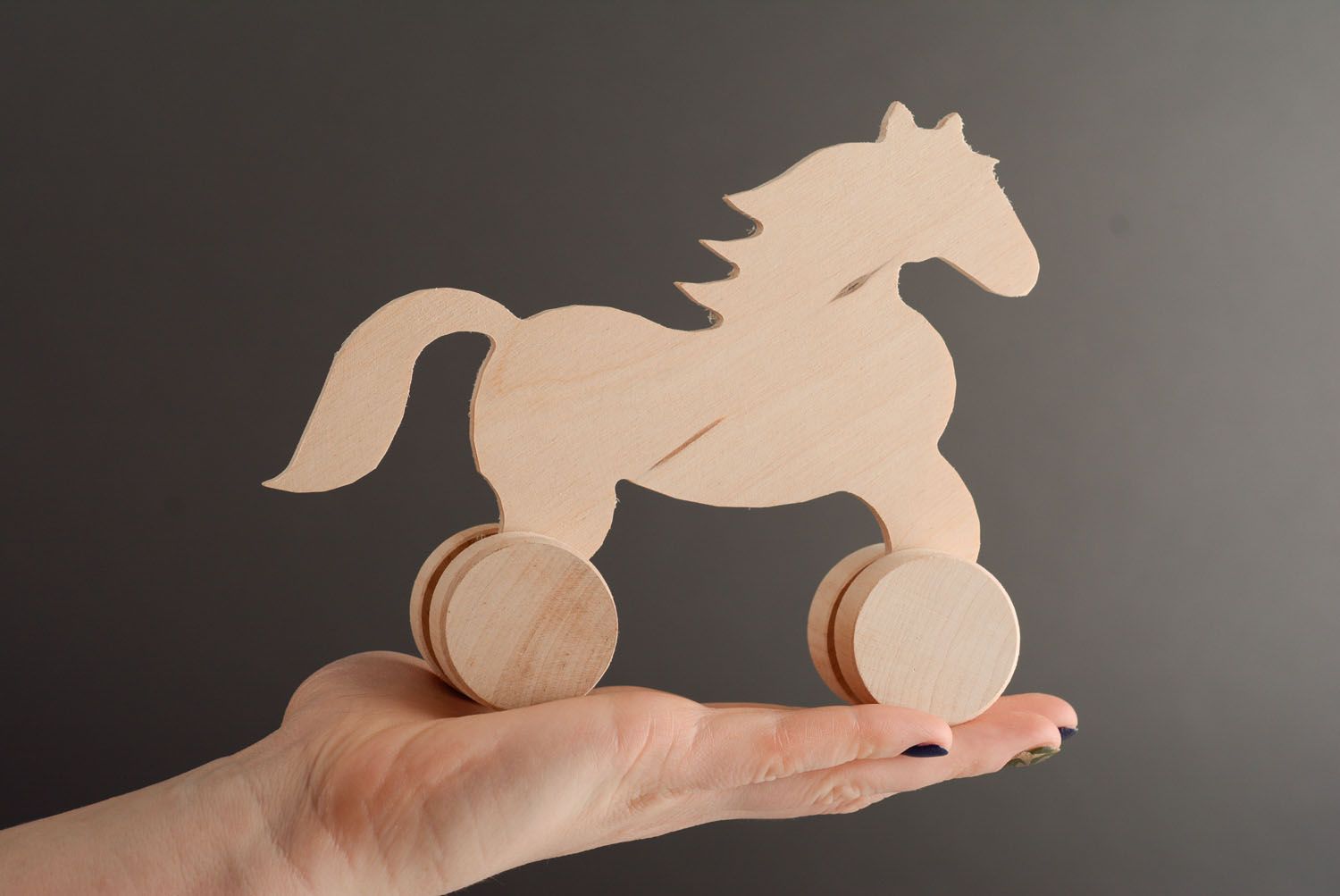 Оригинальная игрушка из дерева на колесиках Лошадь фото 3