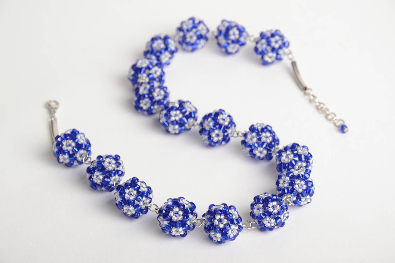 Handmade designer women's necklace with balls crocheted of blue and white beads photo 5