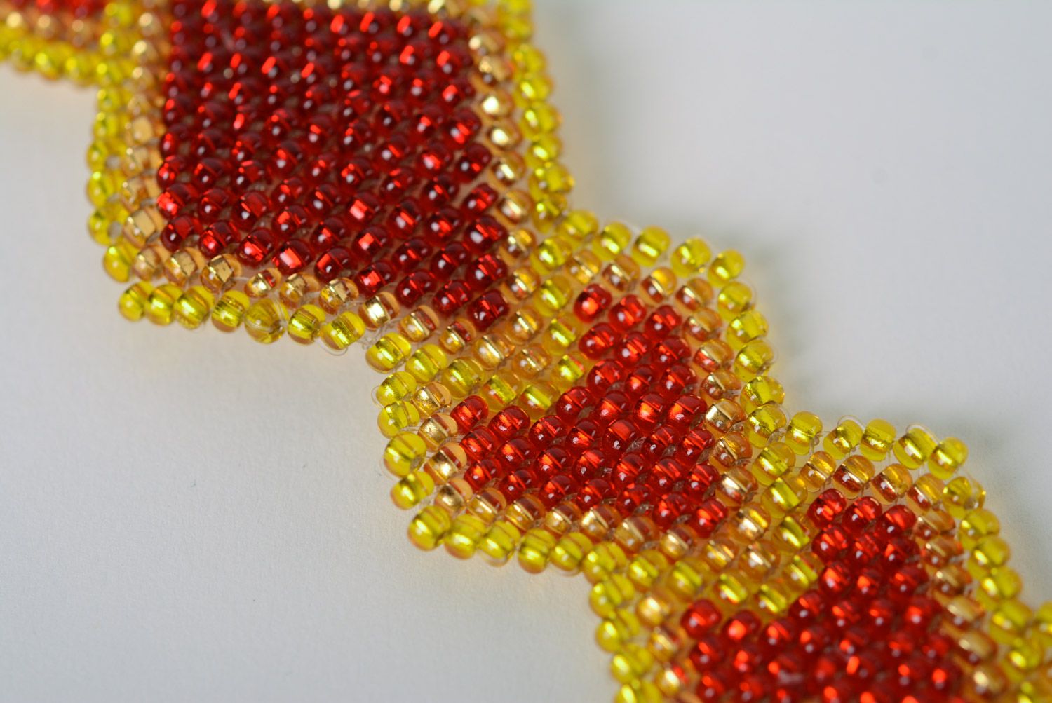 Handmade designer wrist bracelet woven of beads in yellow and red colors  photo 4