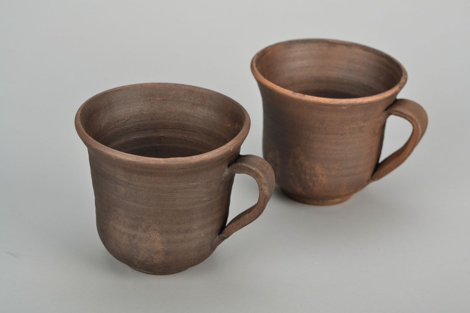 5 oz brown clay cup with handle and no pattern photo 1