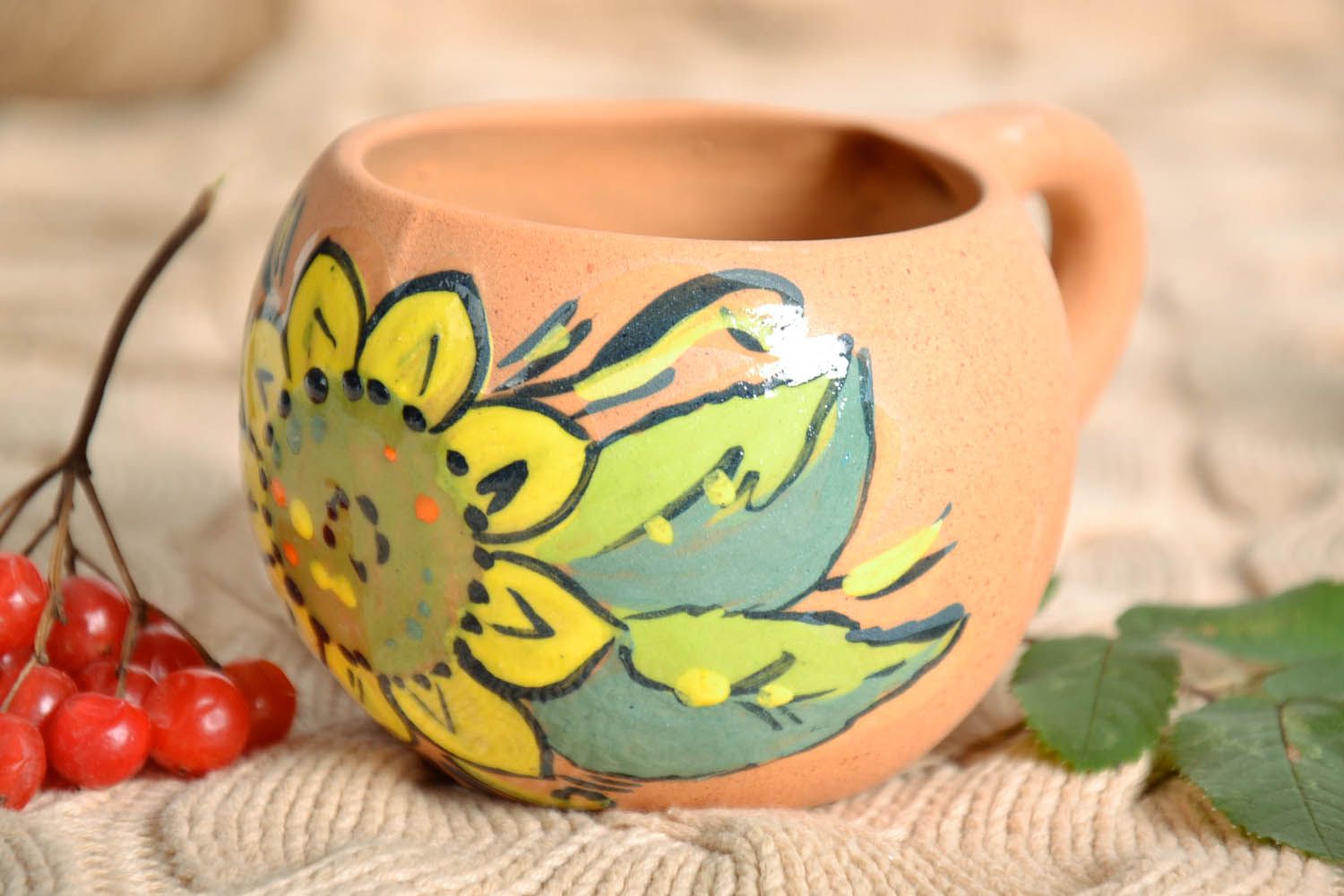 Natural clay rustic cup with handle and lime and yellow color floral pattern photo 1