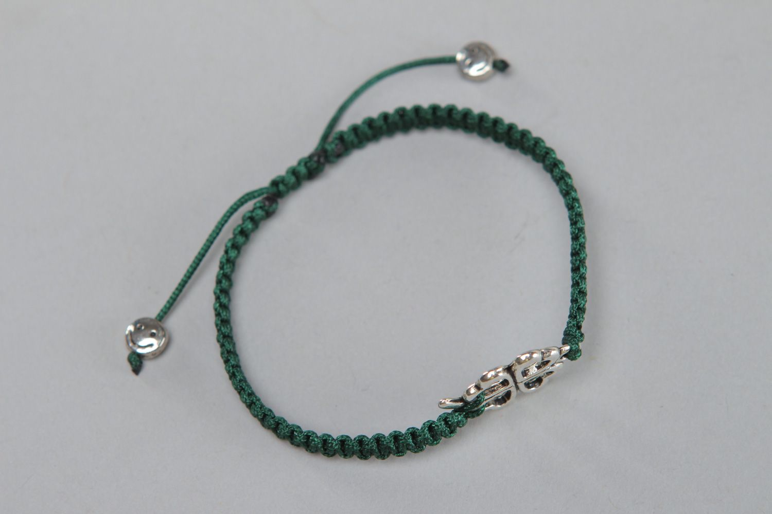 Handmade friendship bracelet woven of green threads with metal insert for women photo 2