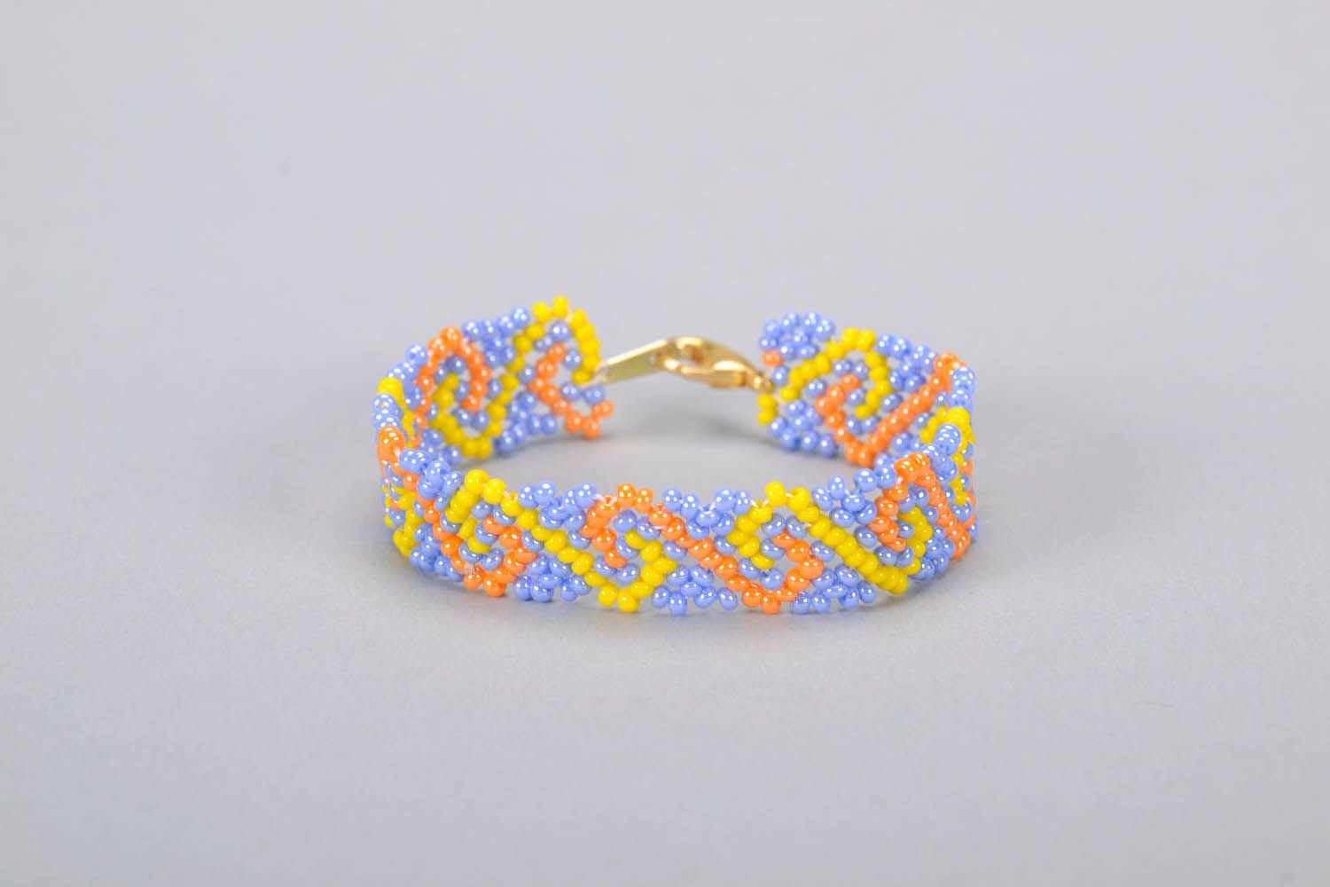 Beaded bracelet with orange, yellow, and blue beads photo 3