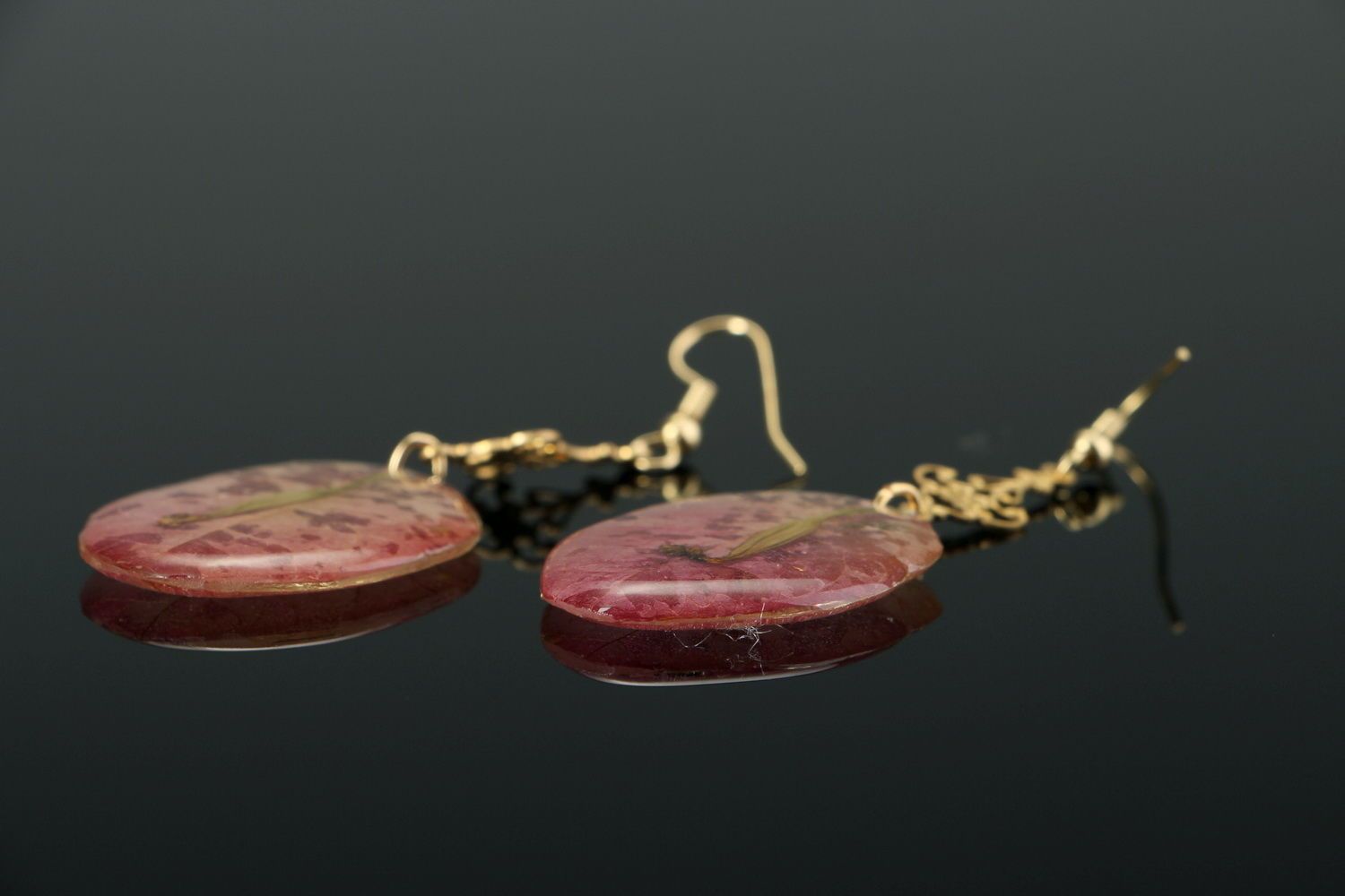 Beautiful earrings with the flowers of bougainvillea photo 2