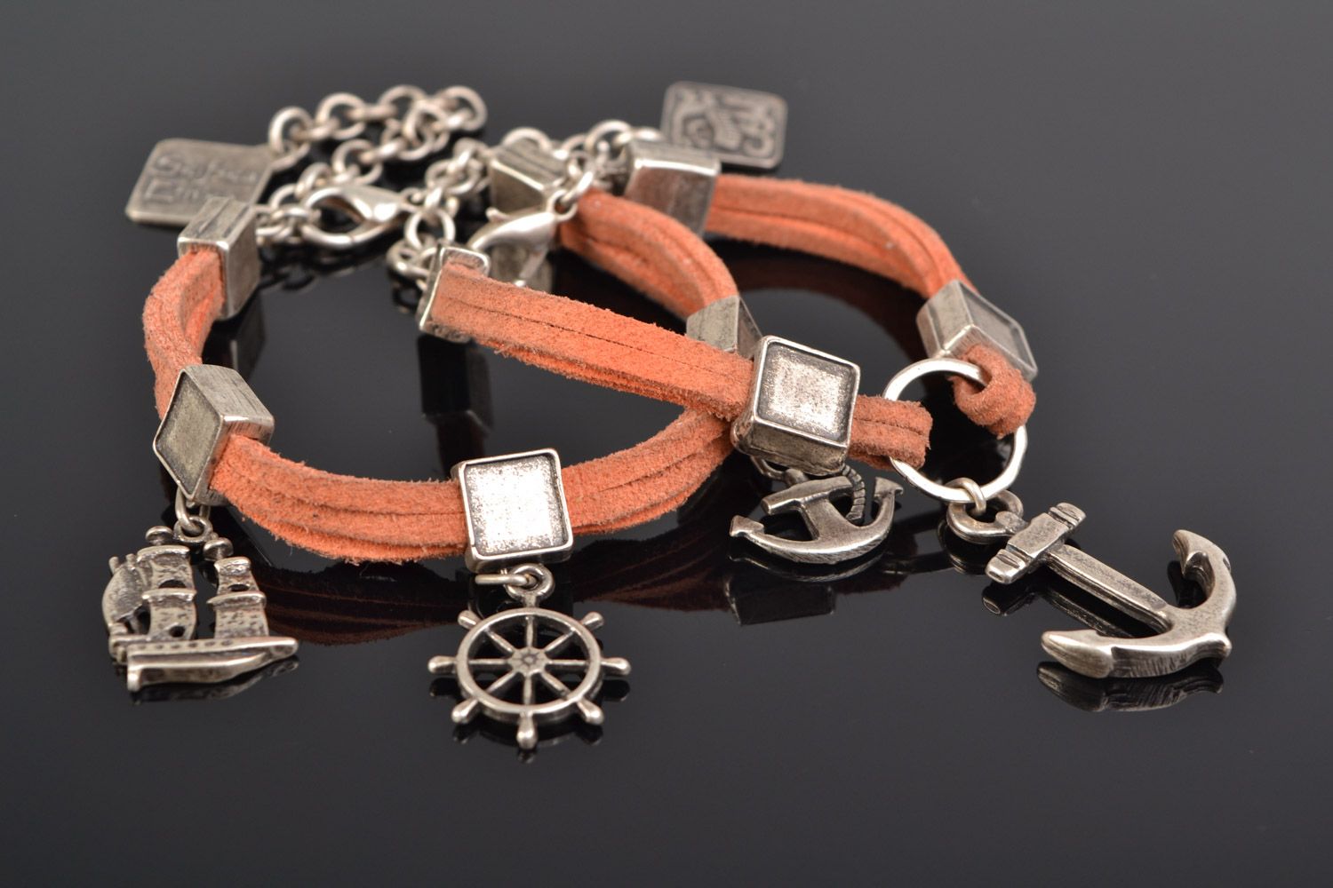 Set of 2 handmade suede cord wrist bracelets of peach color with metal charms  photo 1