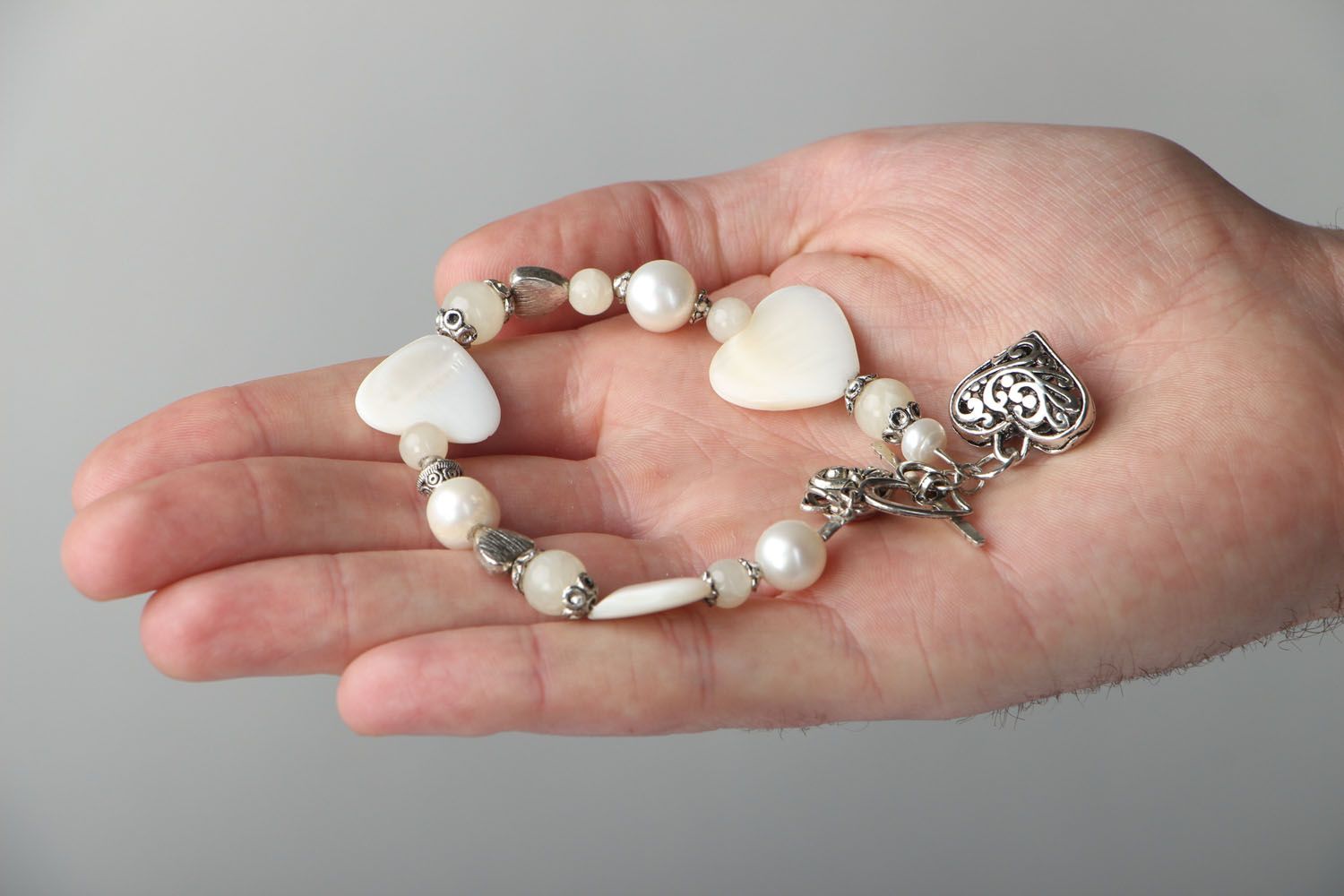 Nacre bracelet with charms photo 4