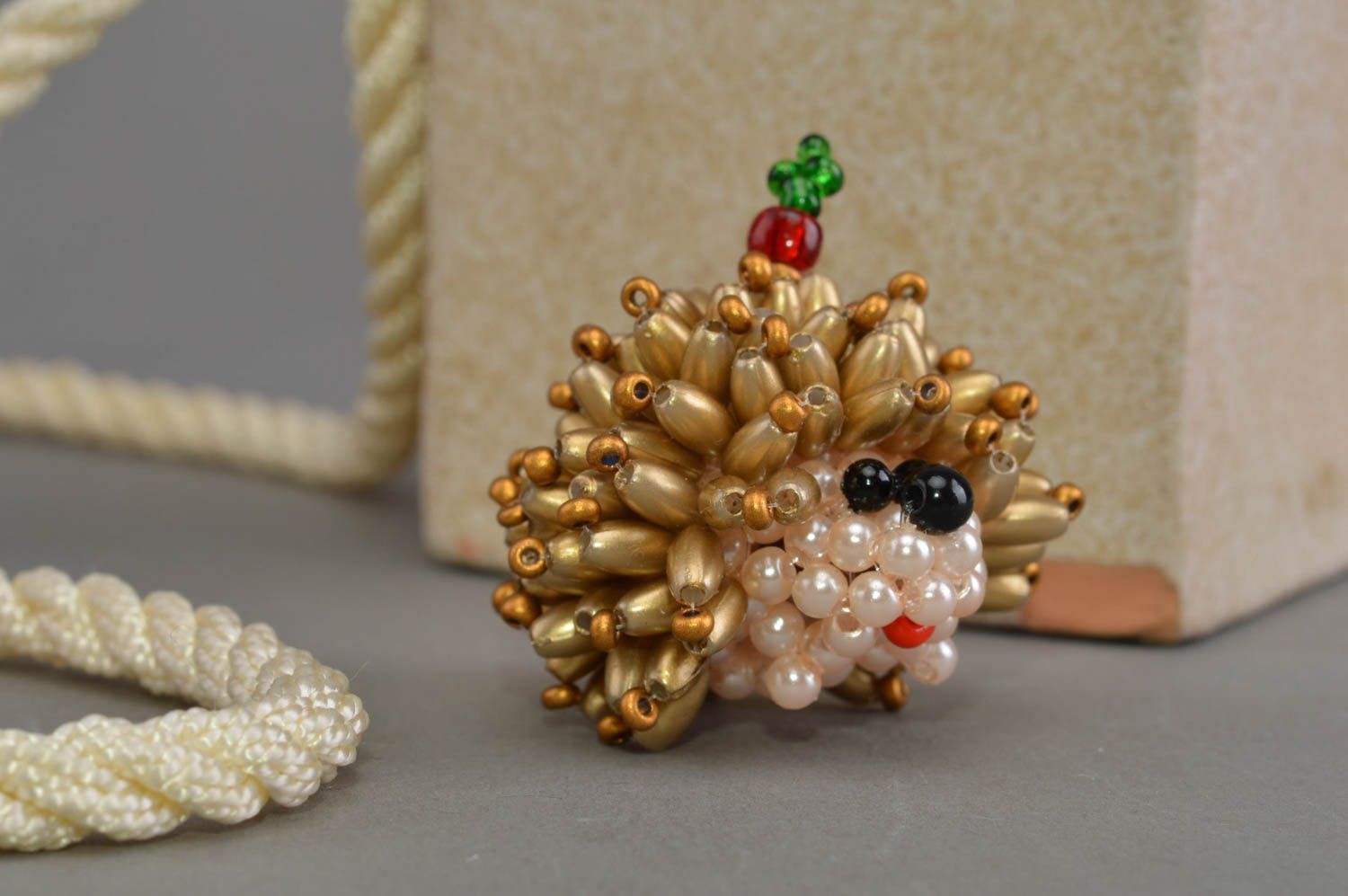 Unusual homemade collectible beaded figurine of hedgehog of gold color photo 1