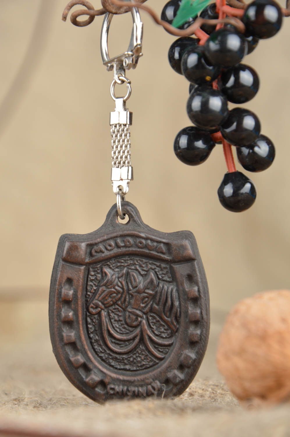 Ceramic handmade keychain in the form of horseshoe beautiful designer accessory photo 1