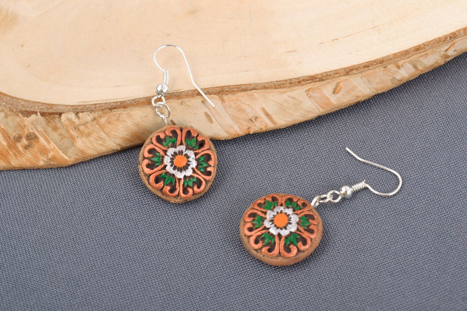 Handmade small round clay earrings with ethnic ornaments painted with acrylics photo 1