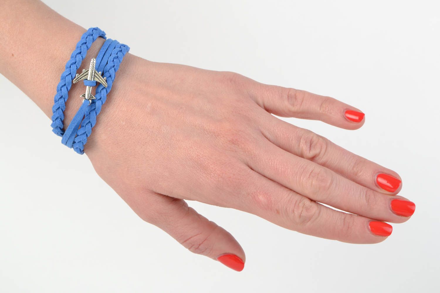 Bright blue handmade woven suede bracelet with charm in the shape of plane photo 2