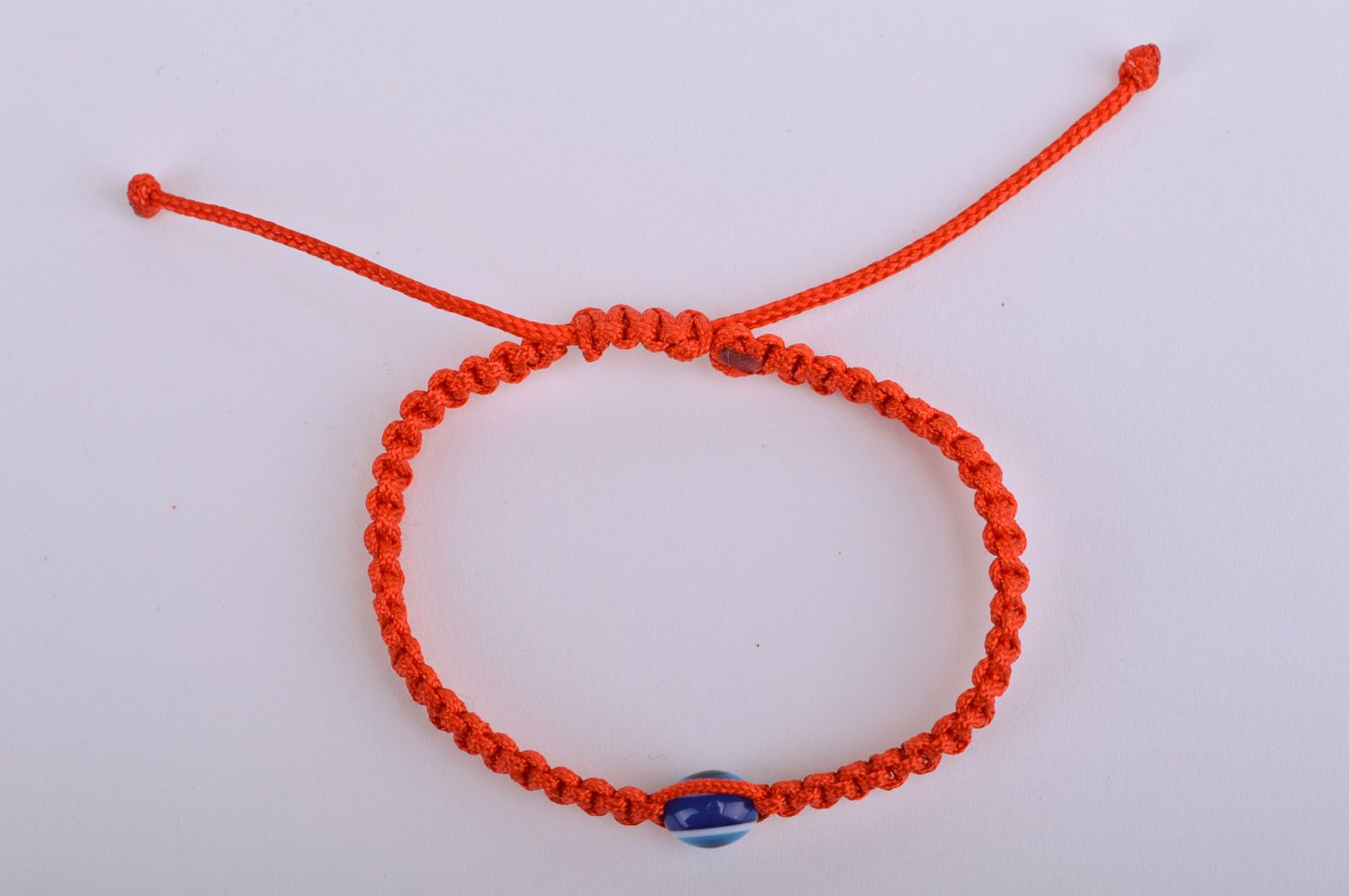 Braided handmade red wrist bracelet made of threads against the evil eye photo 5
