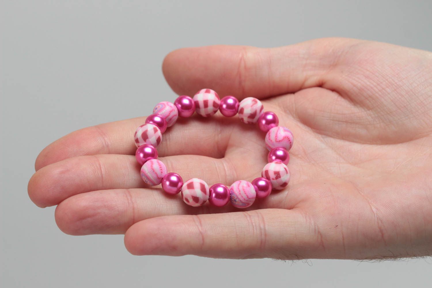 Pink children's handmade designer plastic bracelet with beads on elastic band photo 5
