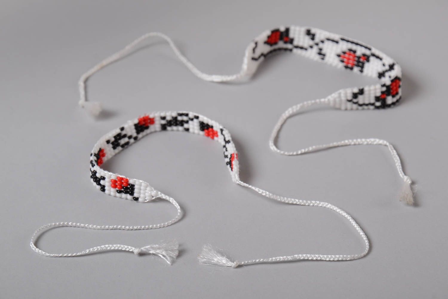Two beaded strand bracelets on white cord with floral ornament for girls photo 5