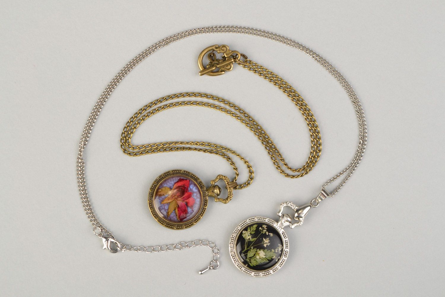 Set of handmade designer botanical pendants with real flowers coated with epoxy 2 items photo 3
