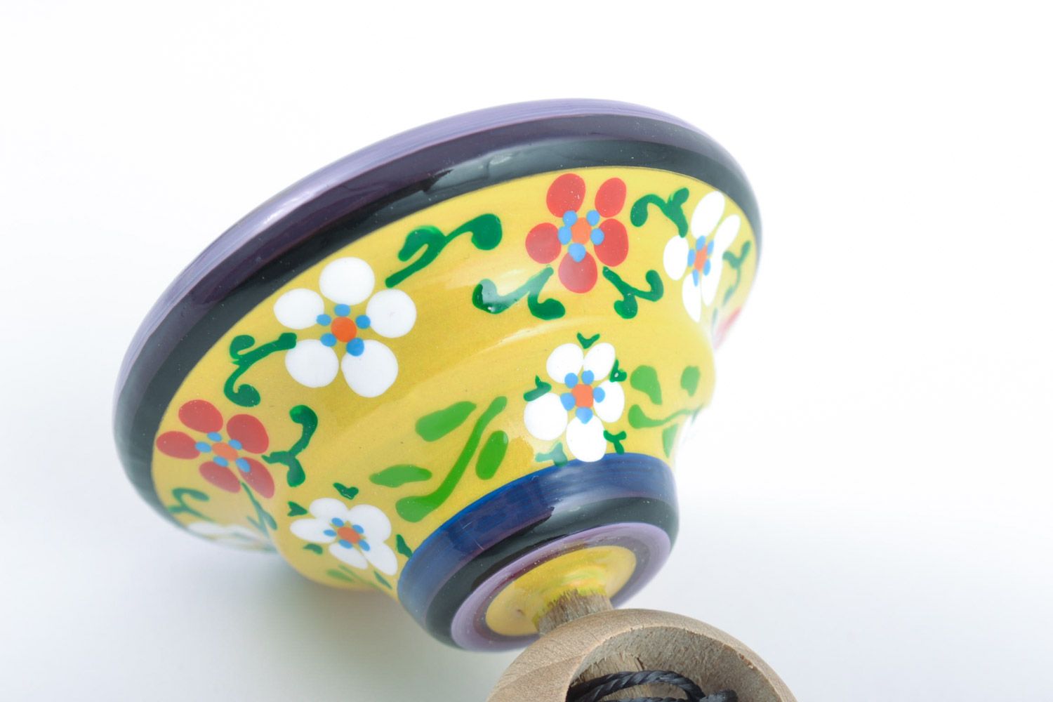 Small decorative painted wooden homemade toy spinning top with floral ornaments photo 4