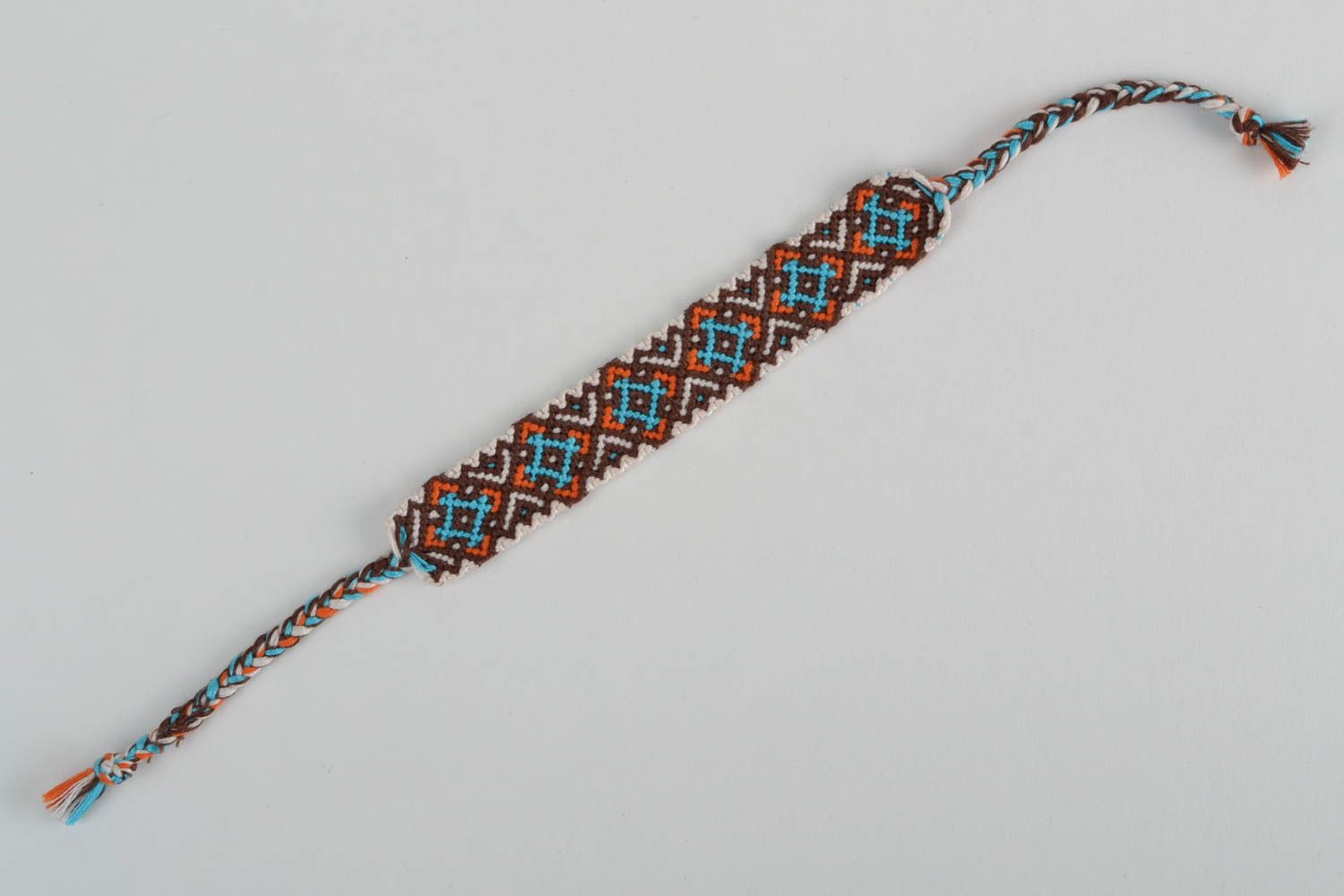 Handmade designer friendship wrist bracelet with ethnic ornament brown and blue photo 5