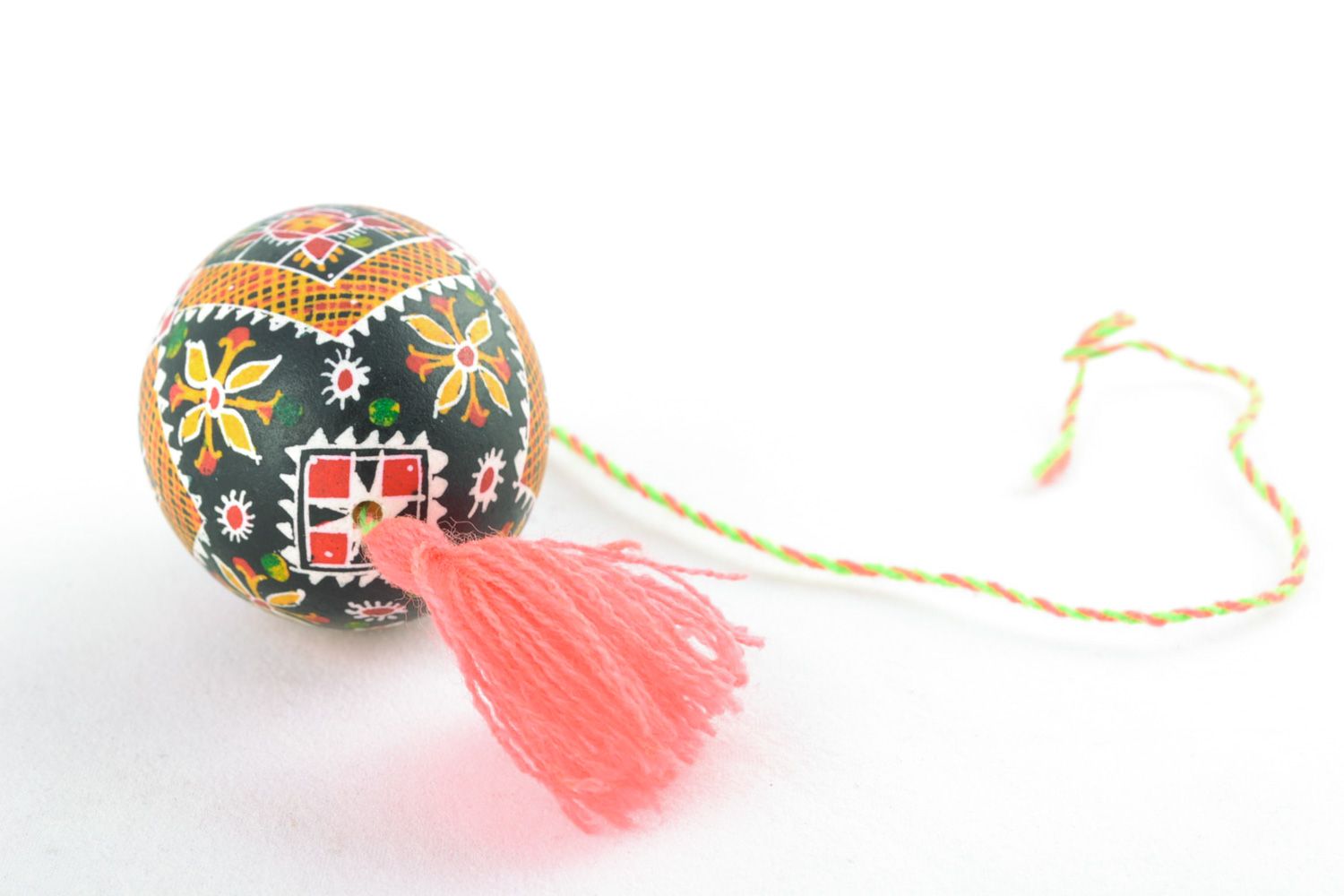 Handmade hanging Easter egg painted with hot wax and decorated with tassel  photo 3