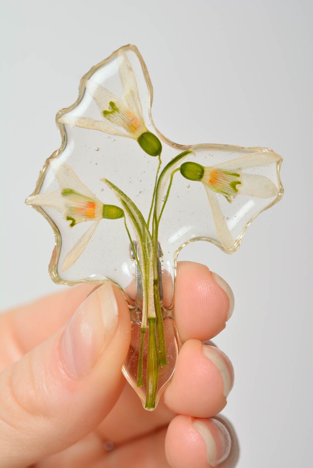 Beautiful transparent handmade brooch with dried flower and epoxy coating photo 2