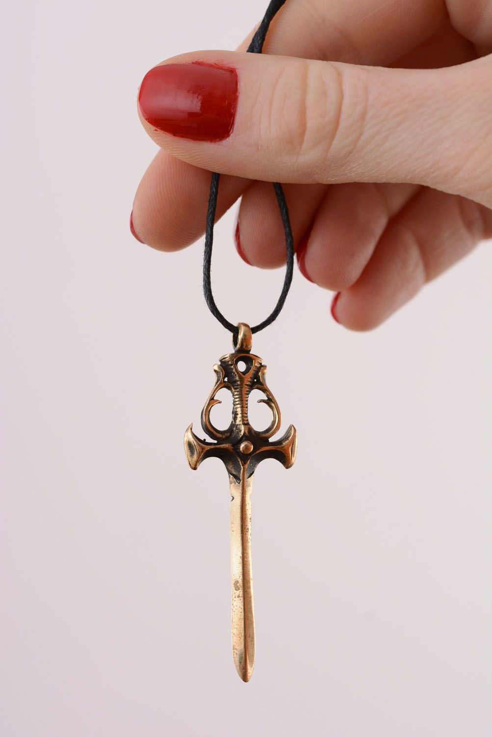 Bronze pendant in the shape of sword photo 4